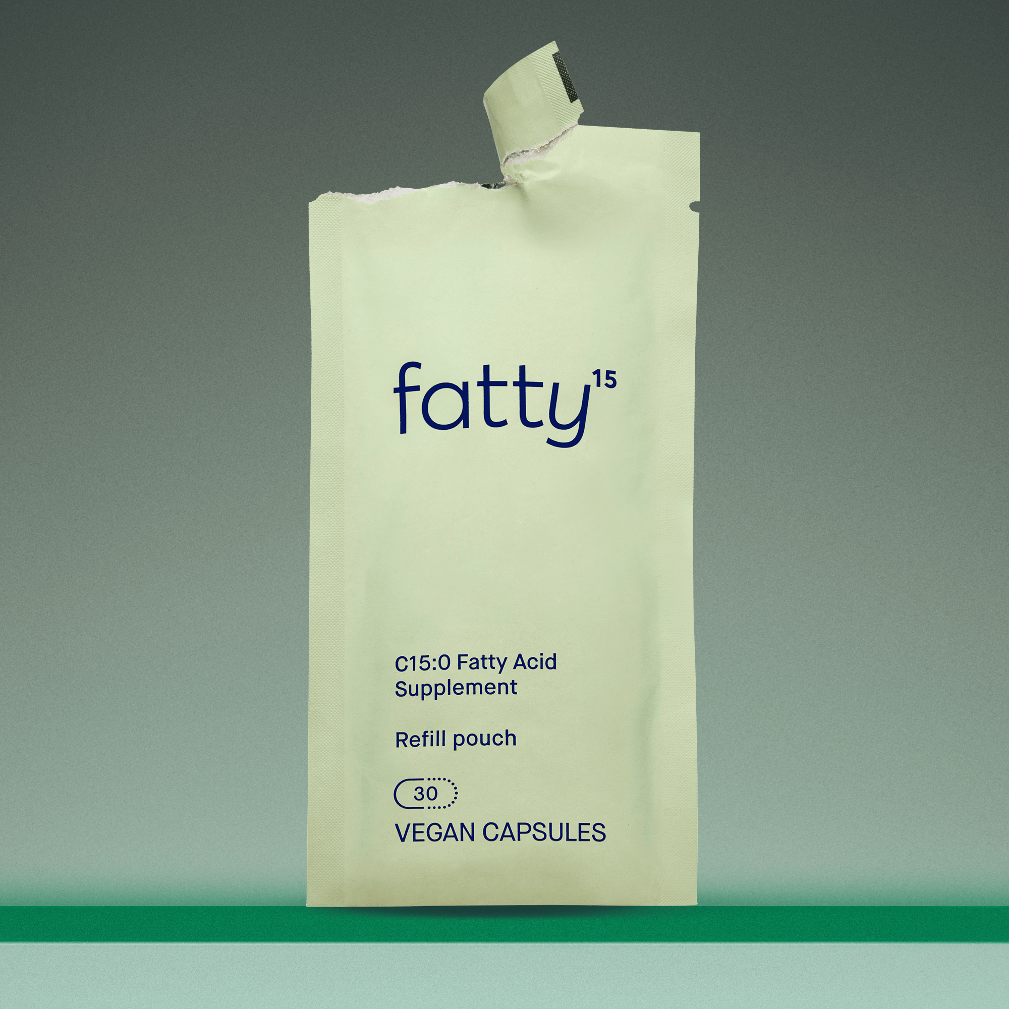 Fatty15's C15 supplement packaging on green background.