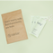Fatty15's C15 supplement packets with paper bag on light background.