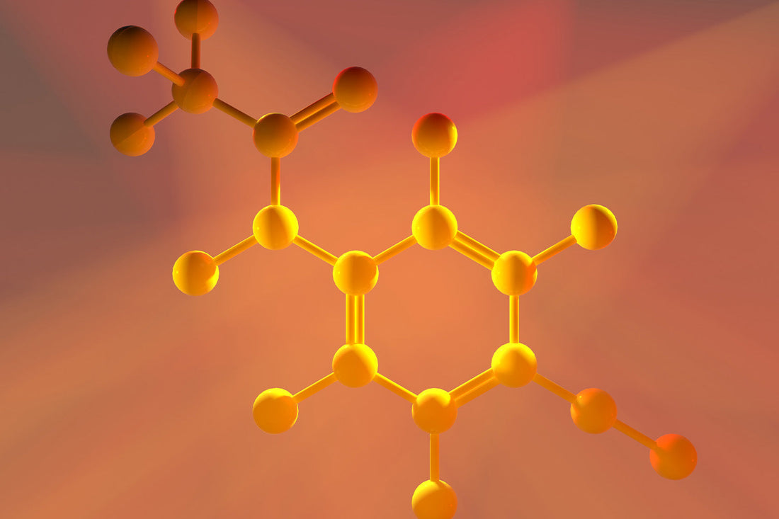 Yellow molecular structure with orange background.