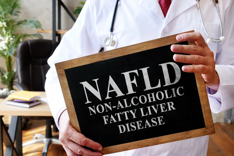 Doctor holding NAFLD non-alcoholic fatty liver disease sign.