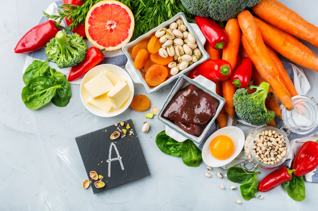Foods rich in Vitamin A, including carrots, grapefruit, and eggs.