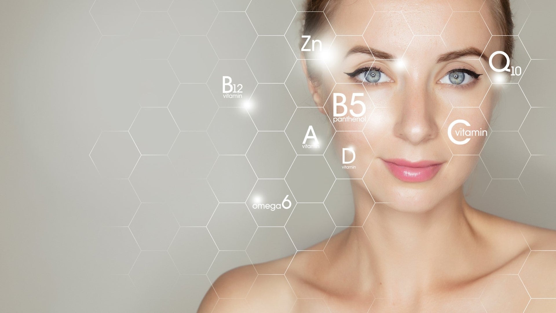 Woman's face with nutritional elements and vitamins overlay.