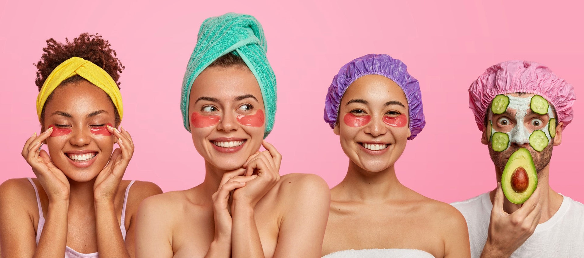 Group enjoying self-care with face masks and cucumbers against a pink background.