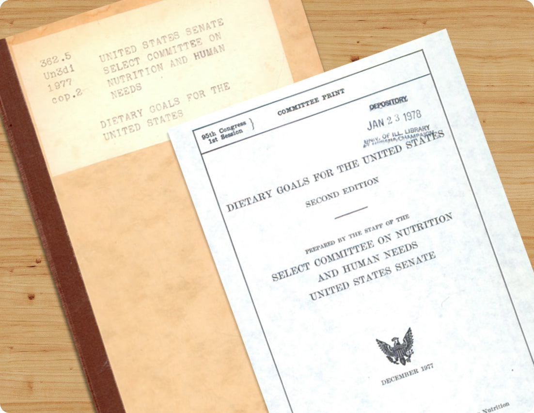 1977 US Senate dietary goals report on wooden table.