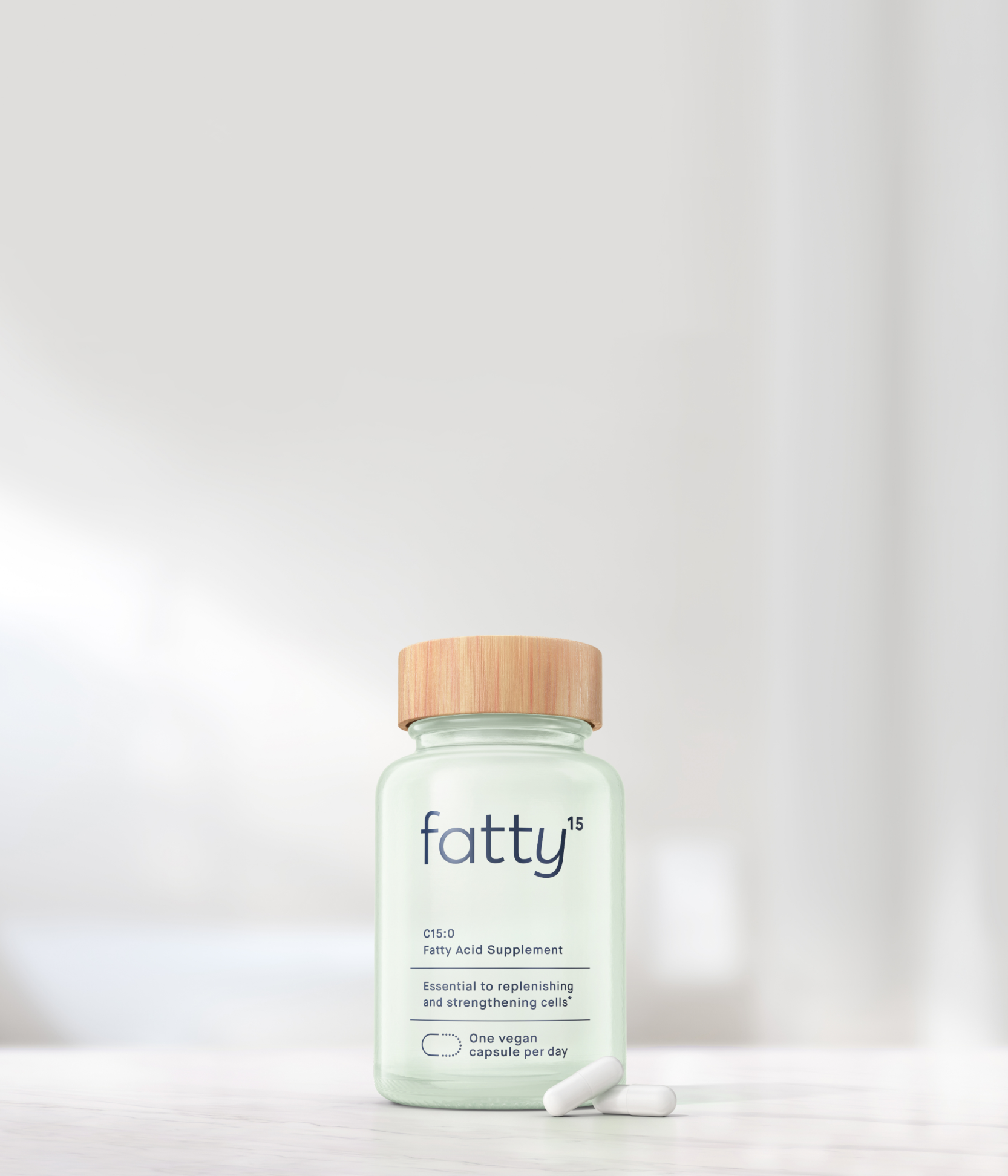 Fatty15's C15 supplement bottle on a bright table.