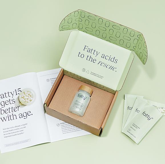 Fatty15's C15 supplement packaging with open box and brochures.